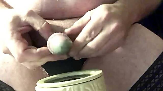Brandon dipping his cock and balls in hot wax