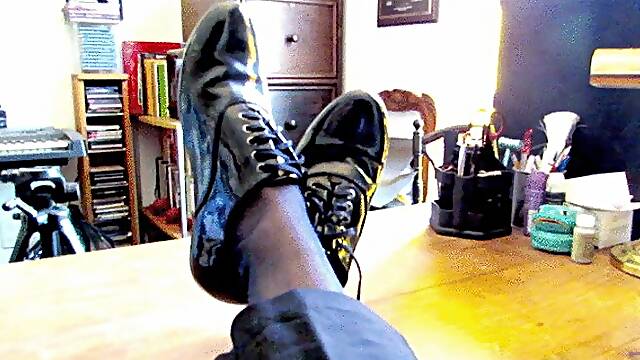 Gio wearing blue sheer socks and patent leather shoes